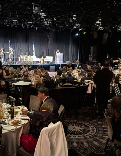 Large ETTA gala dinner room with guests seated at tables.
